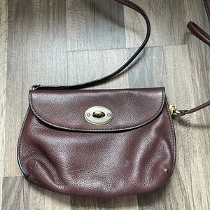 Gently used Fossil brown leather cross body bag.